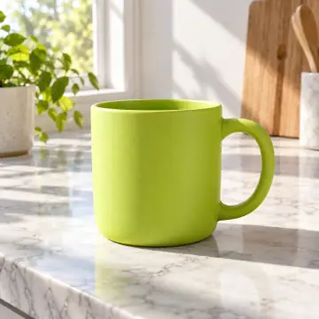 a matte lime mug on a white marble counter, morning sun